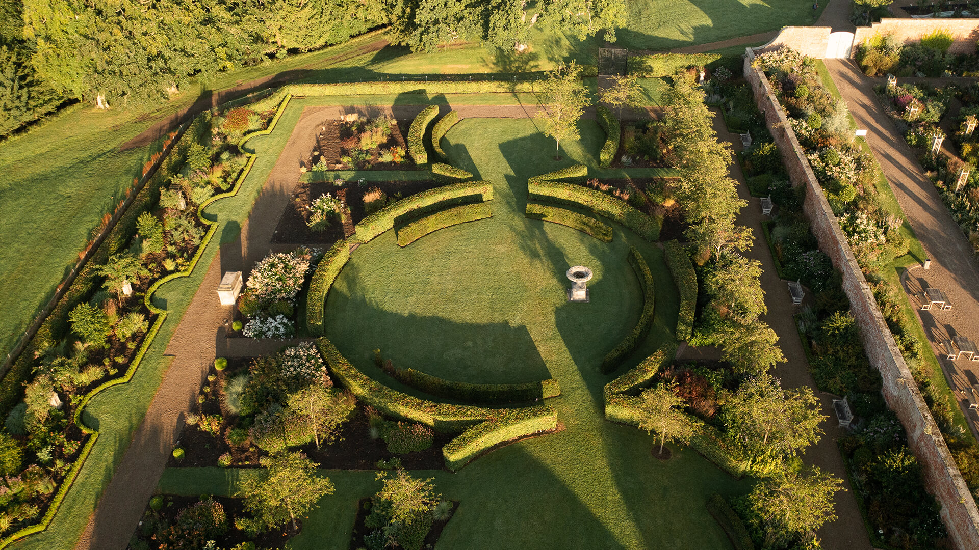 <p>Following the construction of the Grand Marquee, this garden provides panoramic views and open spaces to wander or relax. It contains stunning blossom trees, circular Copper Beach hedges and an array of perennial borders.</p>
